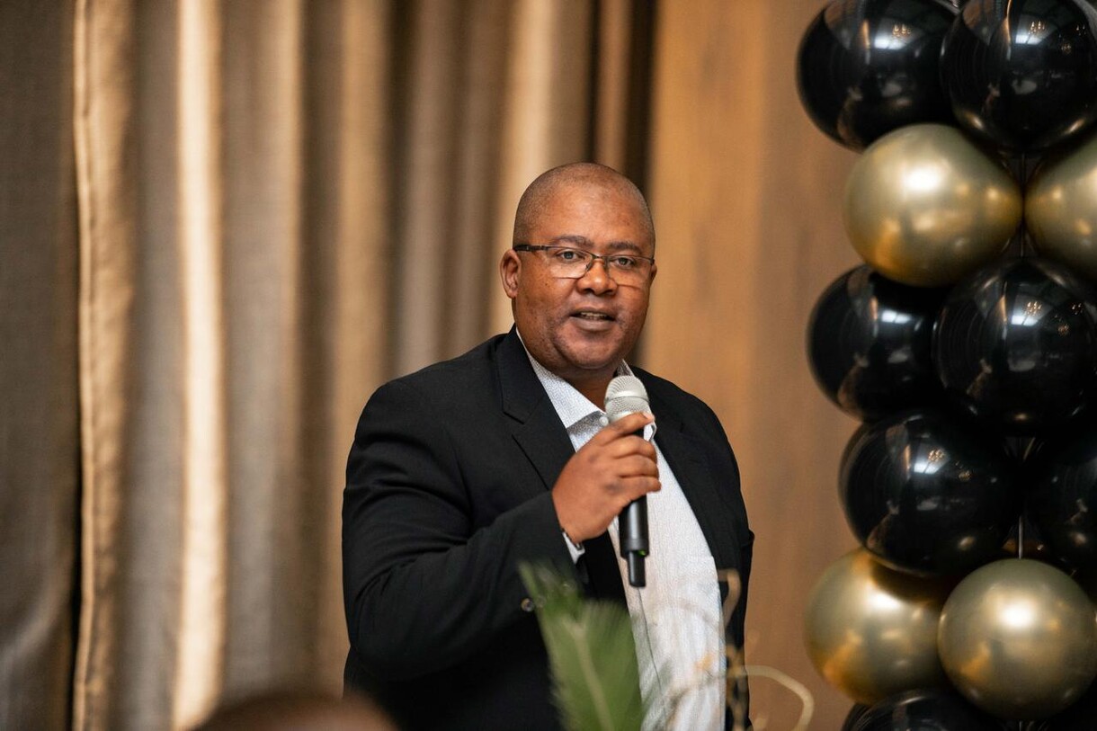 Benjamin Memani, Marriott International's Area Director of Human Resources for Sub-Saharan Africa, congratulates graduates from